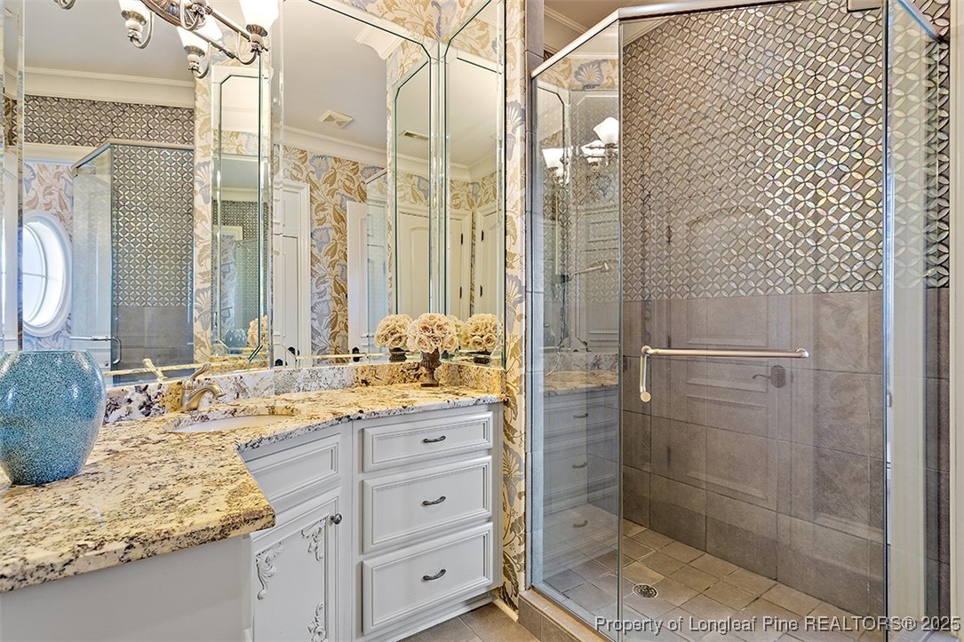 4909 Deep Branch Road Pembroke, NC 28372 - Photo 40 of 50 a bathroom with a granite countertop sink toilet and shower