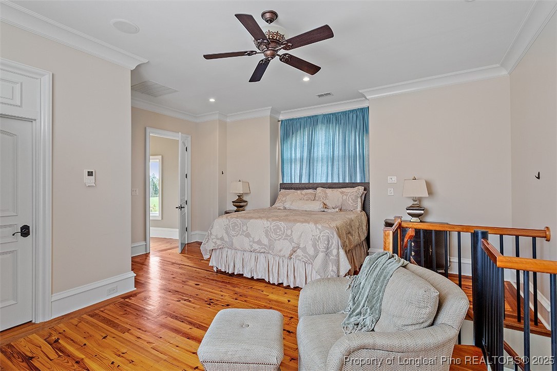 4909 Deep Branch Road Pembroke, NC 28372 - Photo 41 of 50 a bedroom with a bed and wooden floor