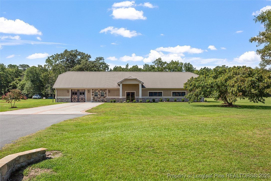4909 Deep Branch Road Pembroke, NC 28372 - Photo 48 of 50 a aerial view of a house with swimming pool and a yard