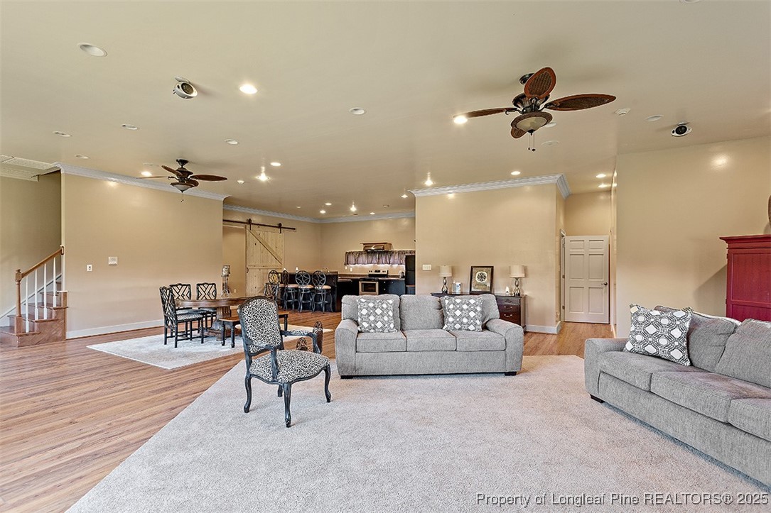 4909 Deep Branch Road Pembroke, NC 28372 - Photo 50 of 50 a living room with furniture and a wooden floor