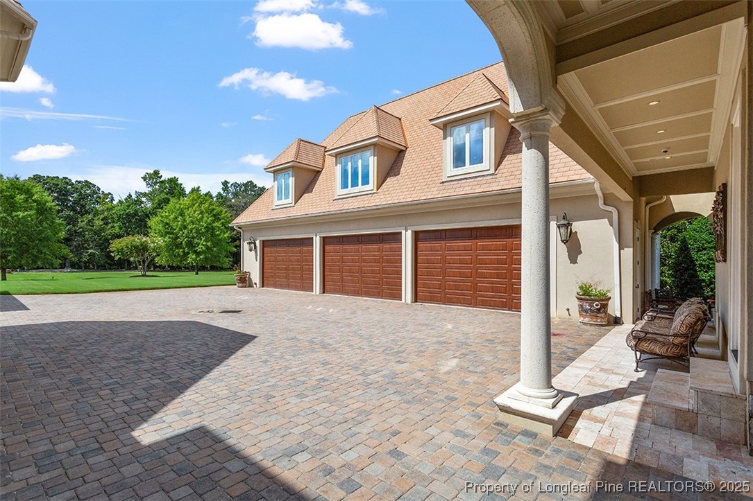 4909 Deep Branch Road Pembroke, NC 28372 - Photo 5 of 50 a front view of a house with garden