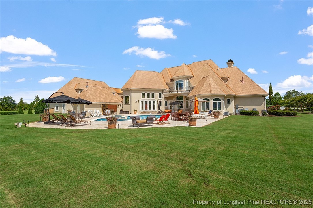 4909 Deep Branch Road Pembroke, NC 28372 - Photo 6 of 50 a view of a house with garden and a yard