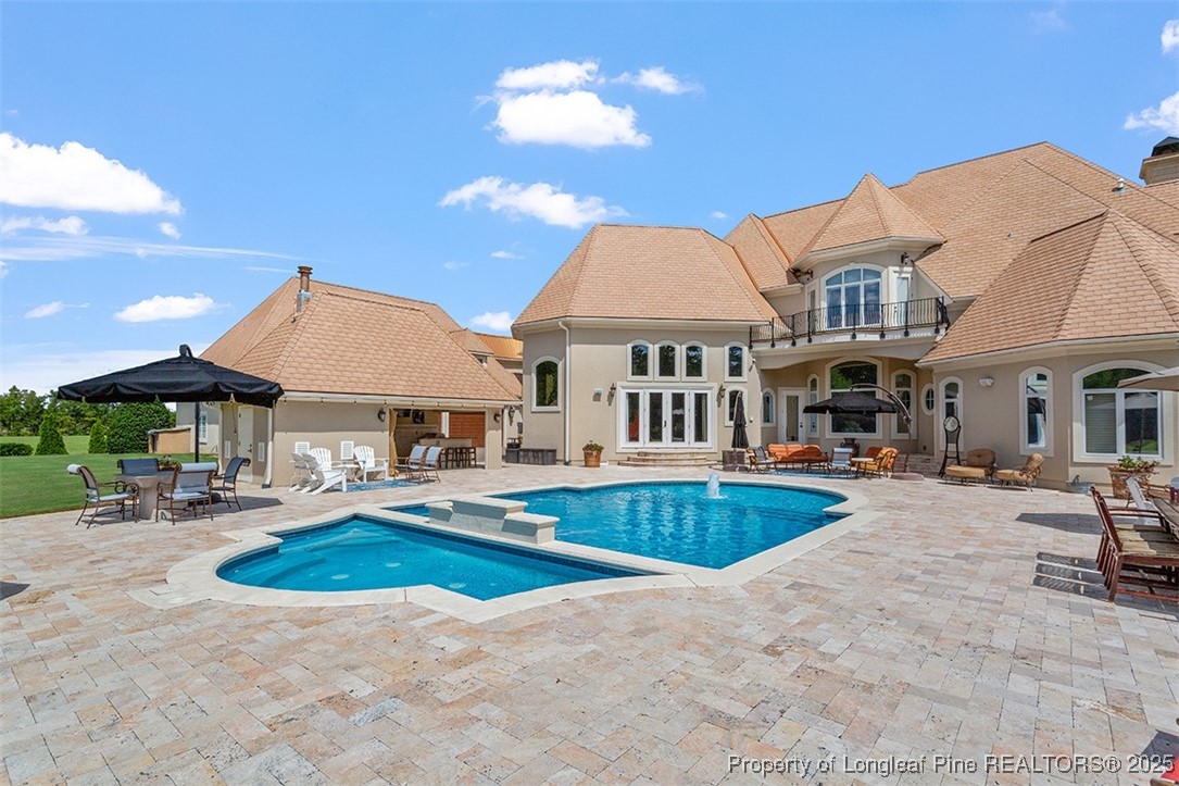 4909 Deep Branch Road Pembroke, NC 28372 - Photo 8 of 50 a view of a house with swimming pool and sitting area