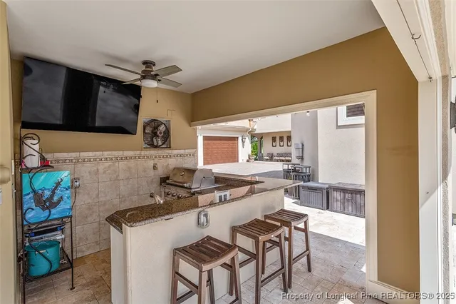 a kitchen with a table and chairs in it