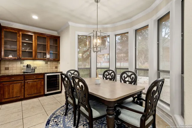 a view of a dining room and a table and chairs