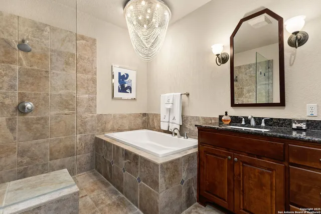 a bathroom with a double vanity sink mirror and