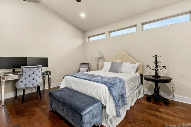 a bedroom with a bed and chair