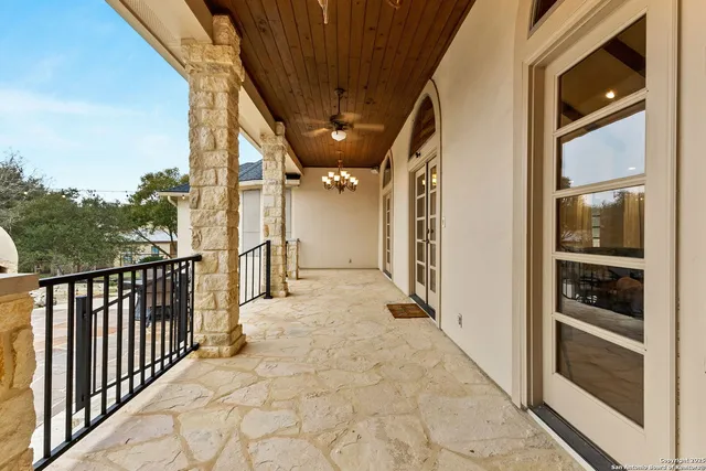 a view of a patio with a table and chairs