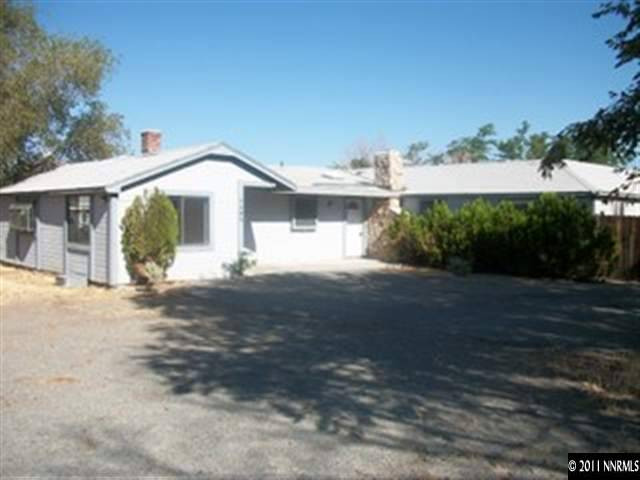 1595 Short Ridge Drive Reno, NV 89521 - Photo 1 of 12 a front view of a house with a yard