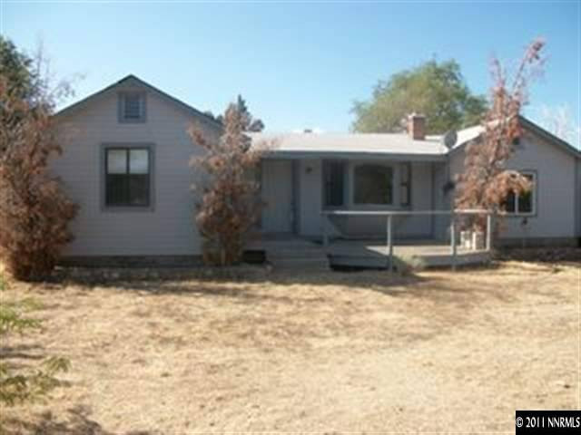 1595 Short Ridge Drive Reno, NV 89521 - Photo 3 of 12 a front view of a house with a yard