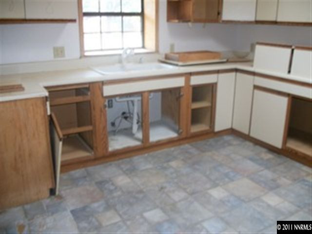 1595 Short Ridge Drive Reno, NV 89521 - Photo 4 of 12 a kitchen with a sink and a window