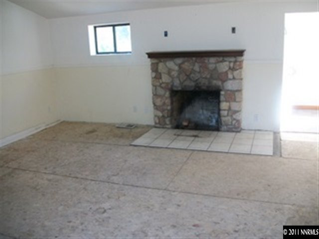 1595 Short Ridge Drive Reno, NV 89521 - Photo 8 of 12 a living room with a fireplace
