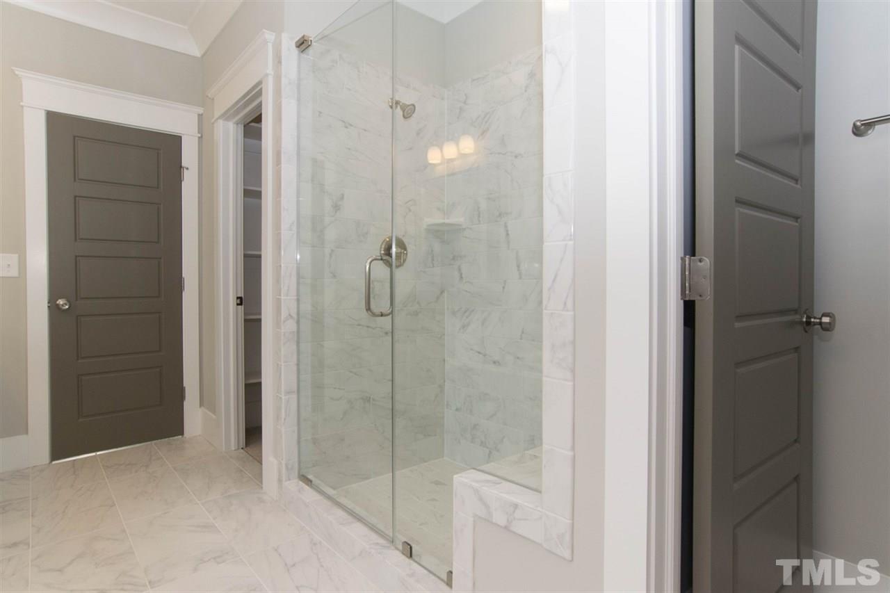 701 Sasser Street Raleigh, NC 27604 - Photo 22 of 25 a bathroom with a glass shower door