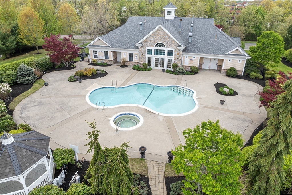 428 John Mahar Highway, Unit 301 Braintree, MA 02184 - Photo 27 of 41 an aerial view of a house with yard and patio