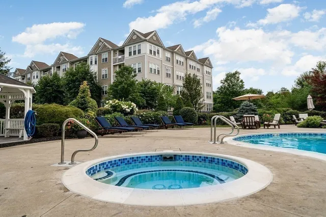 a house view with a swimming pool and a yard