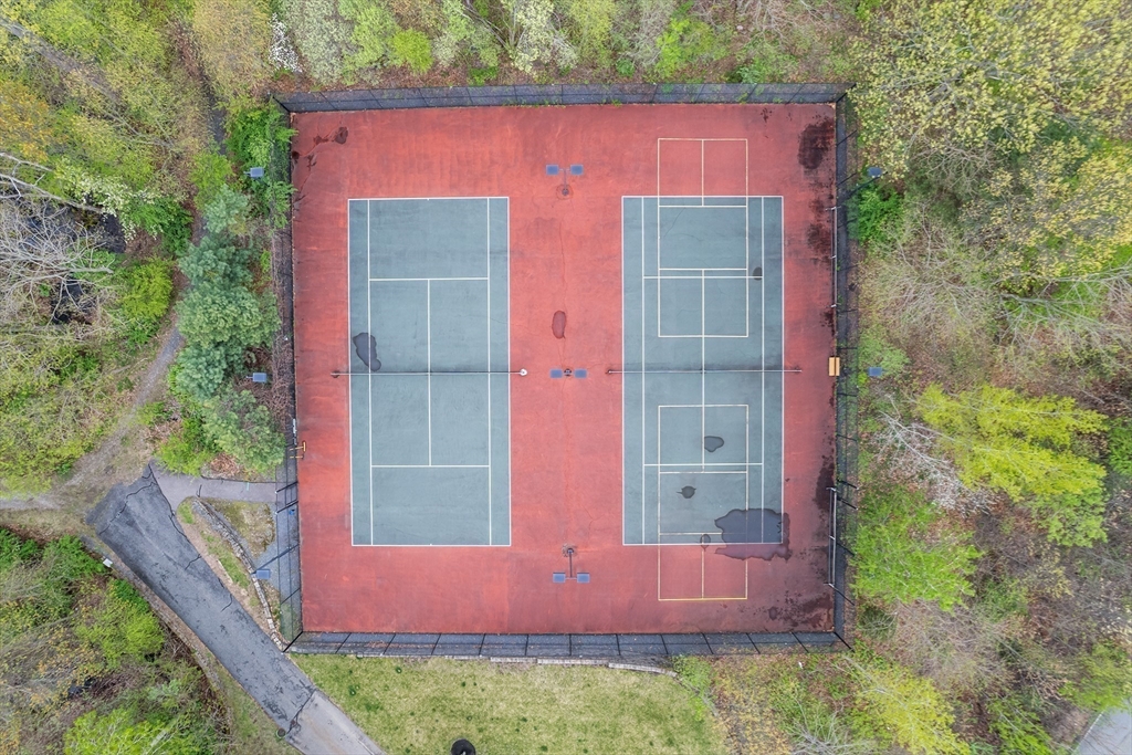 428 John Mahar Highway, Unit 301 Braintree, MA 02184 - Photo 39 of 41 front view of a house with a yard
