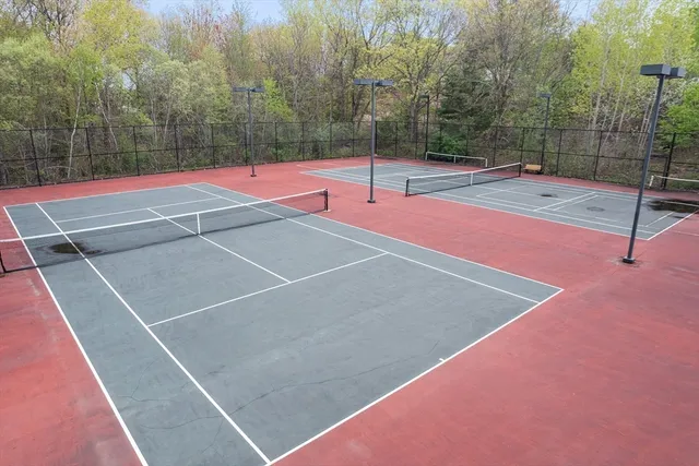 a view of a patio with a table and chairs
