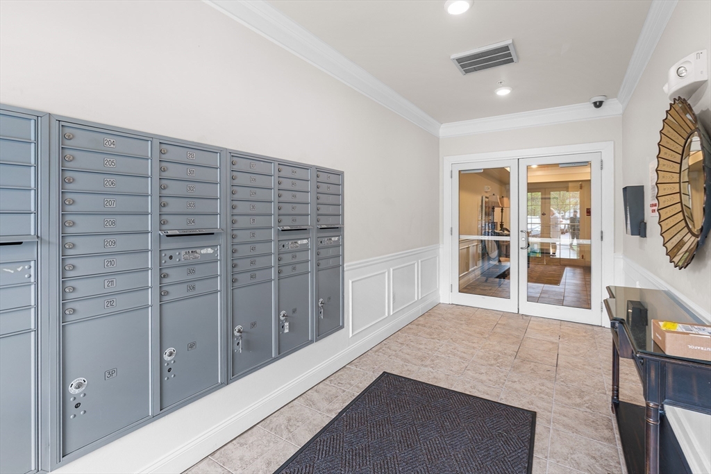 428 John Mahar Highway, Unit 301 Braintree, MA 02184 - Photo 4 of 41 a view of empty room with wooden floor and fan