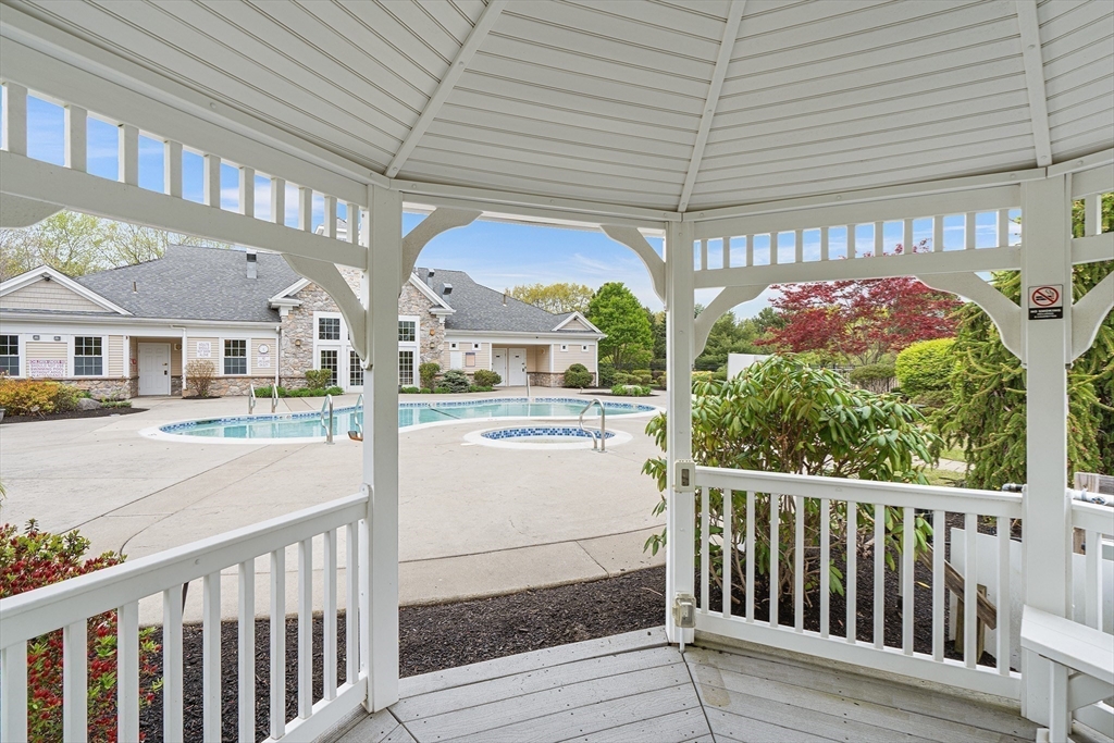 428 John Mahar Highway, Unit 301 Braintree, MA 02184 - Photo 41 of 41 a view of a patio with a table and chairs