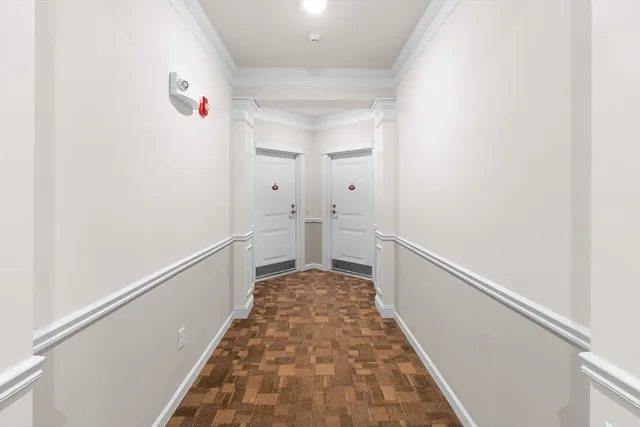 a hallway with a white walls