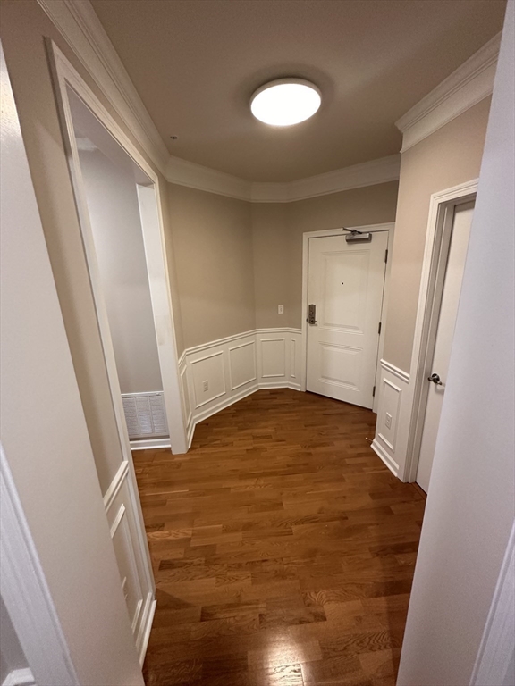 428 John Mahar Highway, Unit 301 Braintree, MA 02184 - Photo 10 of 41 a view of empty room with wooden floor