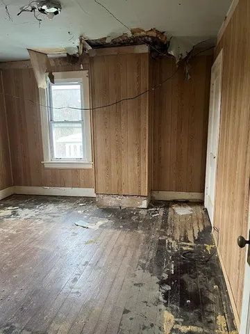 a view of a room with wooden walls