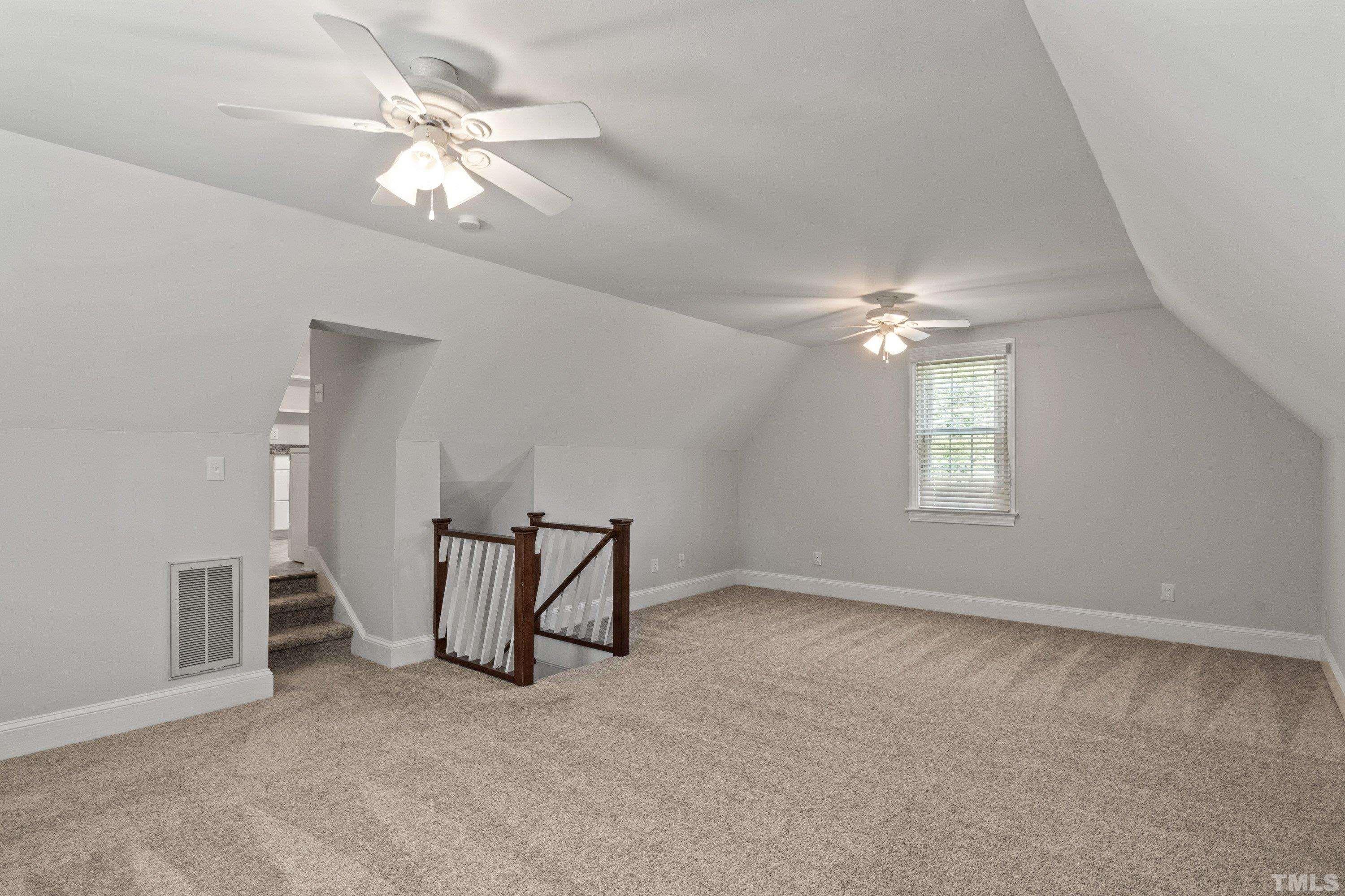 1317 October Road Raleigh, NC 27614 - Photo 54 of 68 a view of a livingroom with a chandelier fan