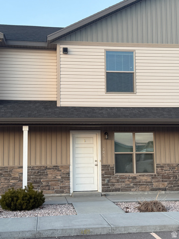 485 370 South Preston, ID 83263 - Photo 2 of 16 View of front of home with board and batten siding, stone siding, and roof with shingles