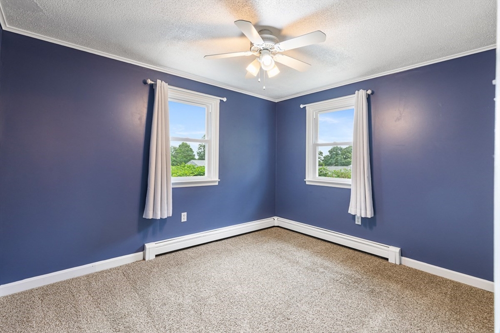 99 Swansom Road Swansea, MA 02777 - Photo 23 of 42 an empty room with windows and fan