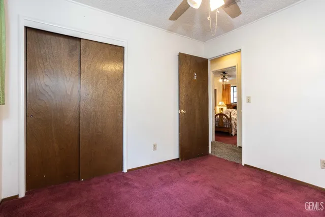 an empty room with a bathroom and a sink
