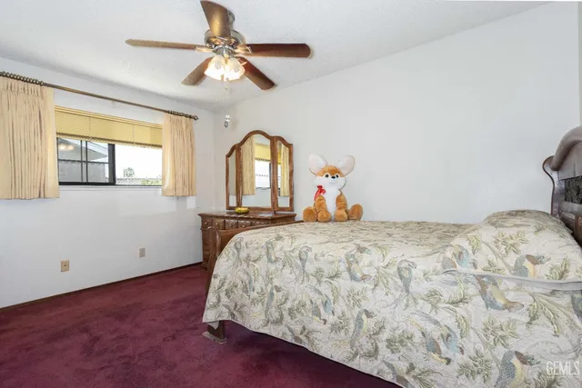 a bed room with a bed and a chandelier