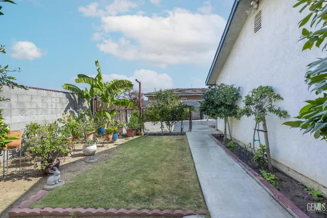 a view of a backyard with potted plants