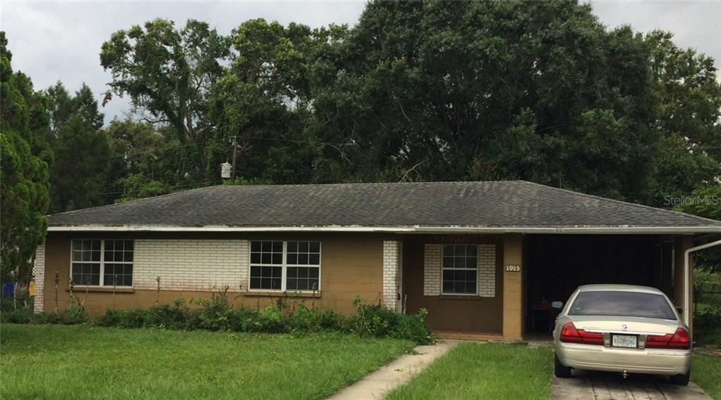1915 East Fern Road Lakeland, FL 33801 - Photo 1 of 1 a front view of a house with a garden and plants