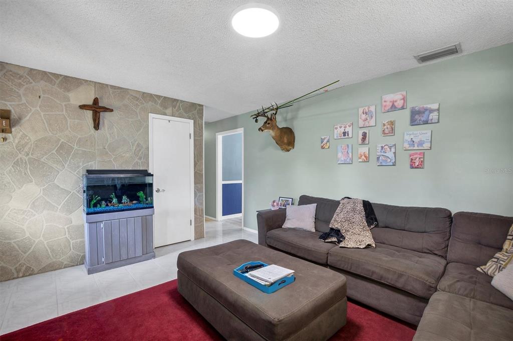 517 Marianna Road Auburndale, FL 33823 - Photo 14 of 37 a living room with furniture and a window