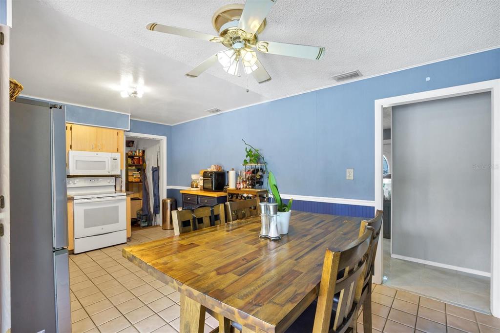 517 Marianna Road Auburndale, FL 33823 - Photo 17 of 37 a view of a dining room with furniture and wooden floor