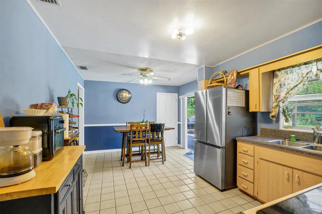 517 Marianna Road Auburndale, FL 33823 - Photo 20 of 37 a kitchen with stainless steel appliances granite countertop a refrigerator and a stove top oven