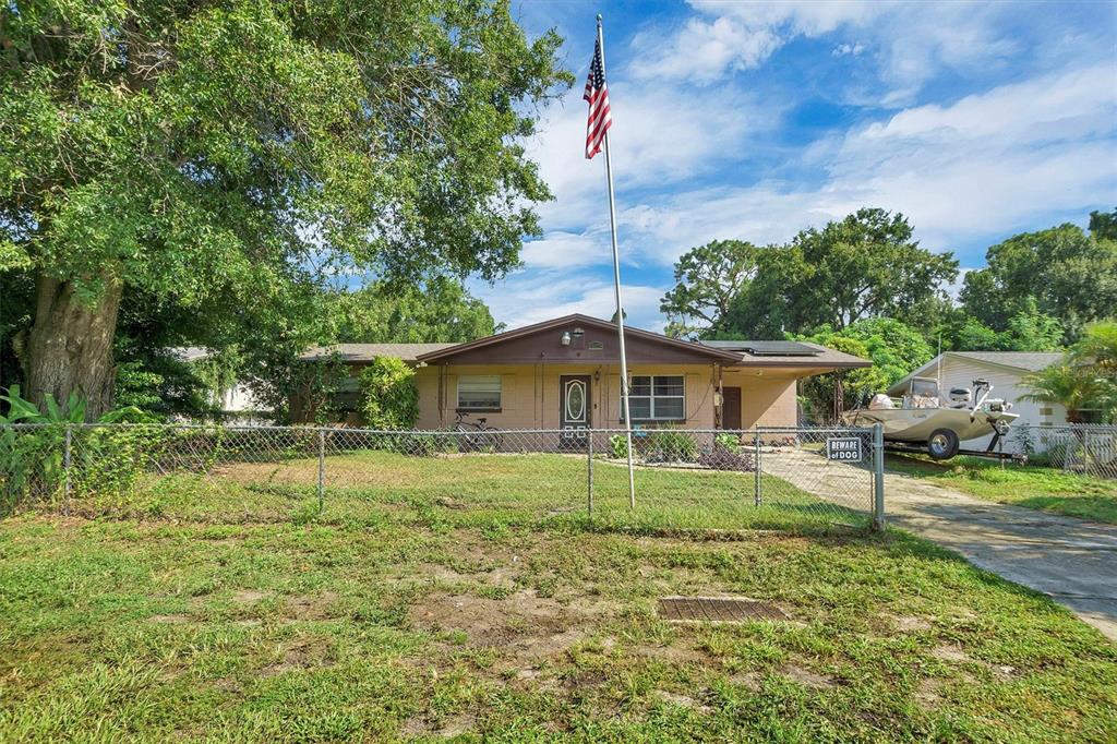 517 Marianna Road Auburndale, FL 33823 - Photo 3 of 37 a house that has a tree in front of it