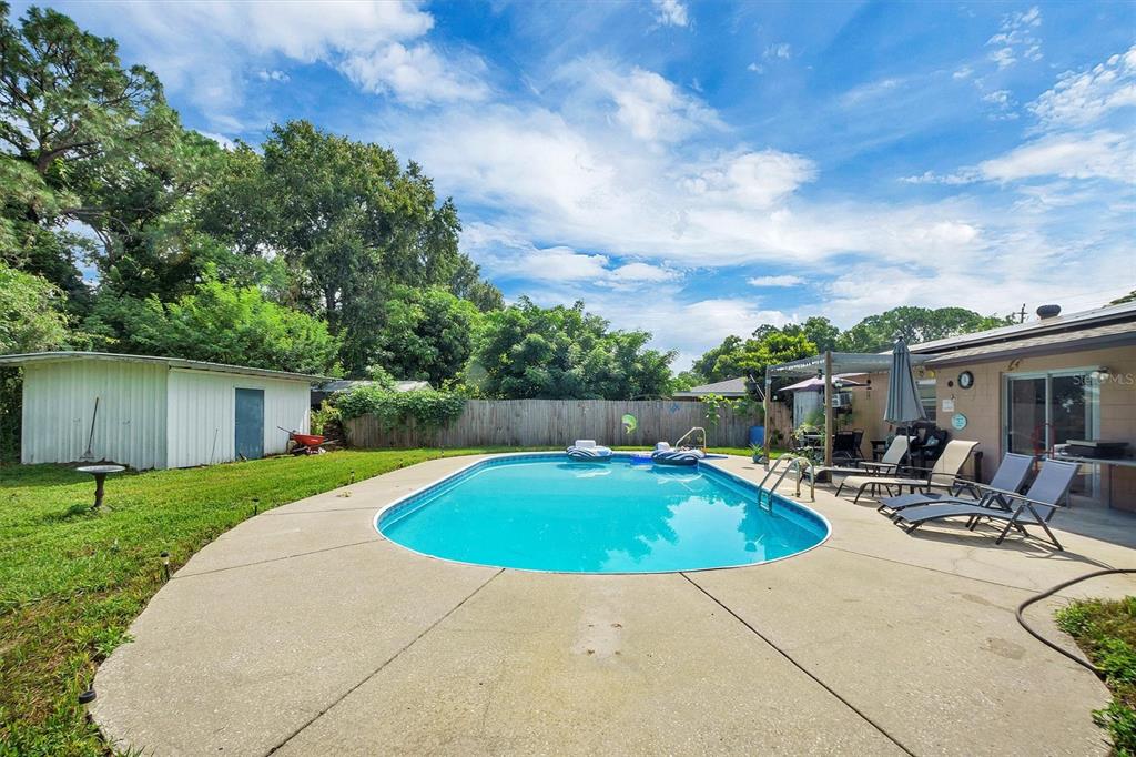 517 Marianna Road Auburndale, FL 33823 - Photo 31 of 37 a view of a house with swimming pool and sitting area