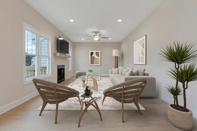 a view of a livingroom with furniture and a fireplace