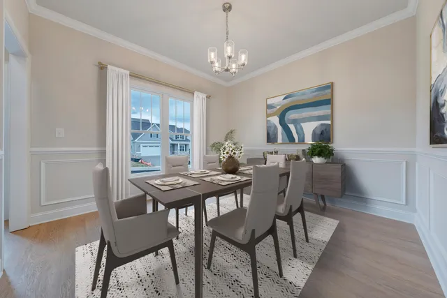 a view of a dining room with furniture and window