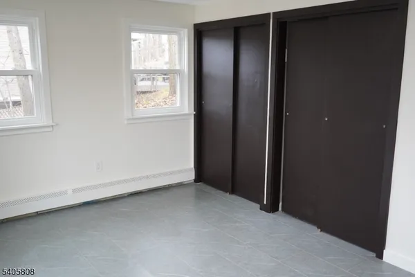 an empty room with closet area