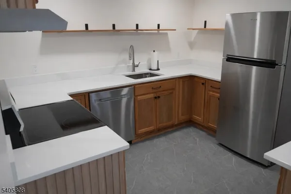 a stove top oven sitting inside of a kitchen