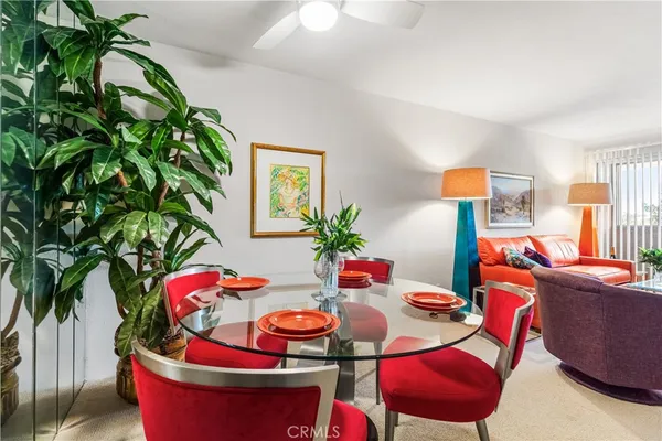 a room with furniture and a potted plant