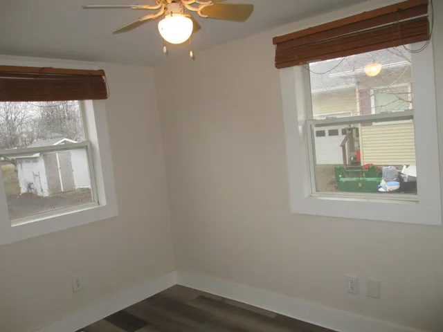 a view of wooden floor and a window