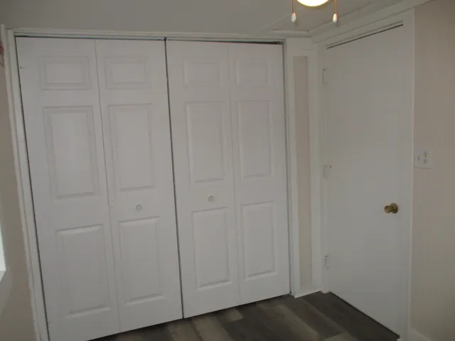 a white bath tub sitting next to a white toilet