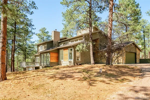 a view of a house with snow on the road