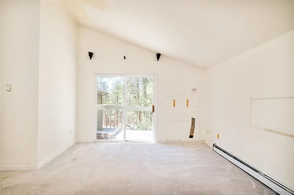 a view of wooden fence and trees