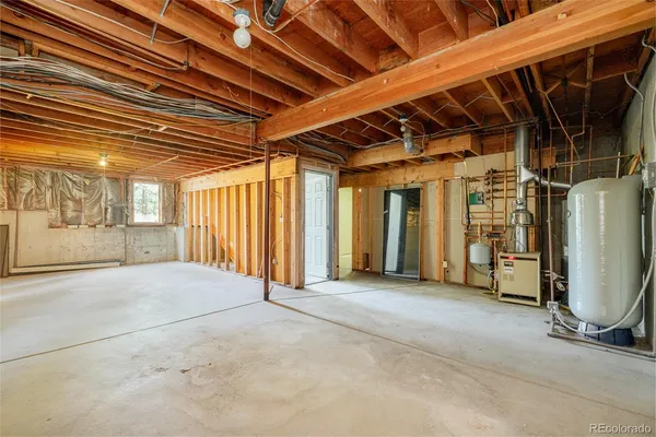 a view of a balcony with wooden floor and fence
