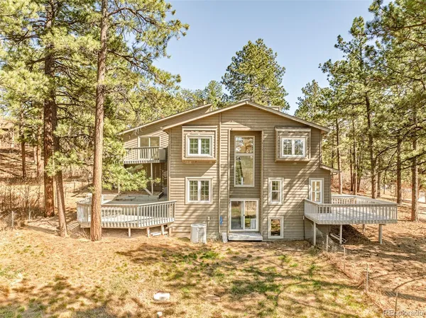 a view of a balcony with wooden floor