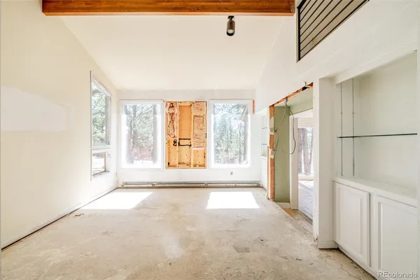 a view of an empty room with a window